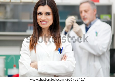 Couple of scientist researching in a laboratory