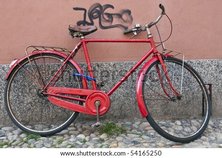 Red bike against a wall