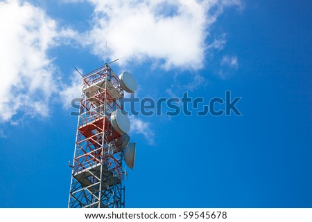 Communication tower over a blue sky