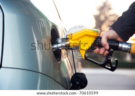 A man pumping diesel in to the tank