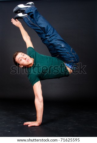 Young guy performing in a cool break dance move