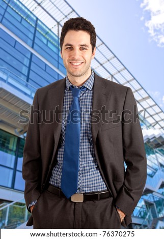 Young businessman against a high tech building