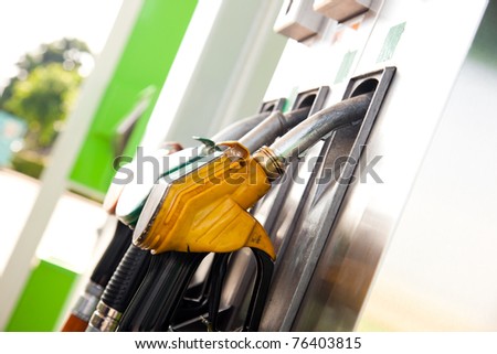 Three gas pump nozzles