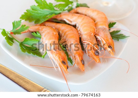 Fresh tiger shrimps on a small plate