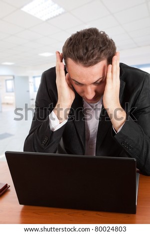 Businessman having problems with computer