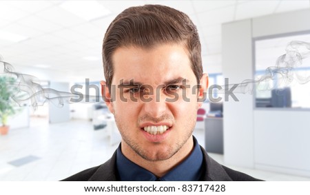 Angry frustrated businessman with exploding head
