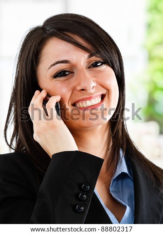 Portrait of a smiling businesswoman speaking on the phone