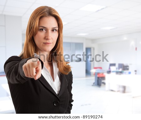 Businesswoman pointing at you