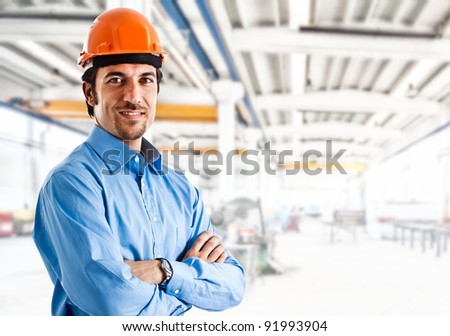 Portrait of an handsome engineer in a factory Portrait of an handsome engineer in a factory