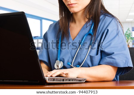 Nurse searching for something using her computer