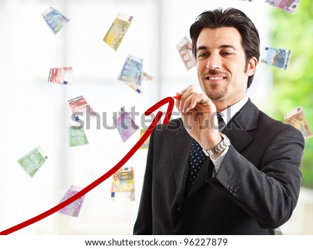 Man drawing a rising arrow, representing financial success