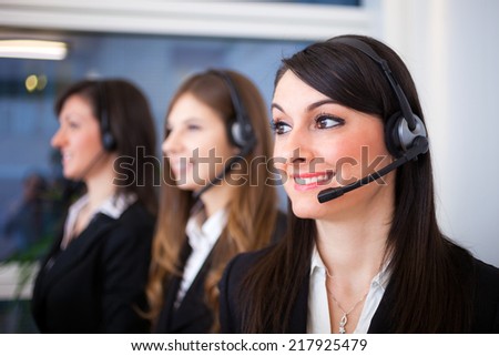 Portrait of a smiling customer representatives at work