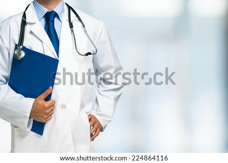Detail of a doctor holding a clipboard