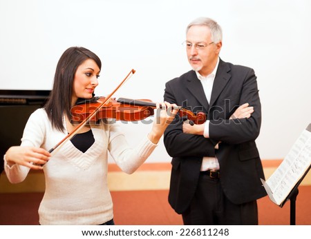 Woman learning to play violin
