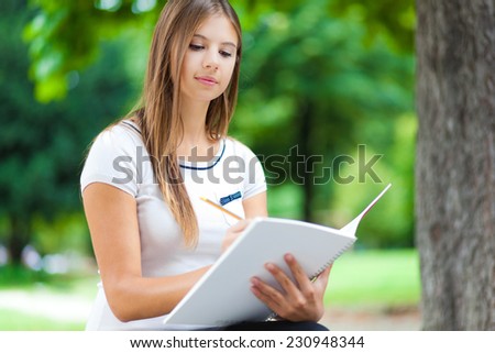 Female student studying at the park