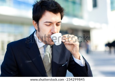 Handsome businessman drinking coffee for breakfast