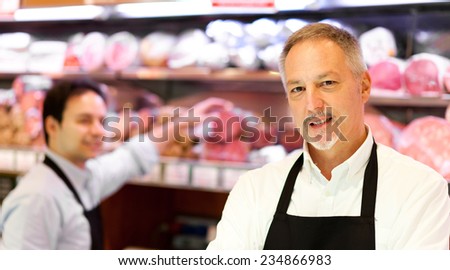 Butchers in a supermarket at work