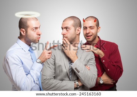 Man listening to the angel and devil self to make a choice