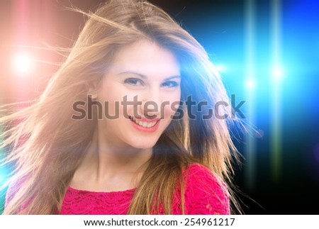 Young woman dancing in a disco