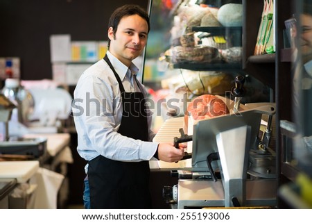 Portrait of a shopkeeper at work in a grocery store