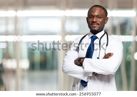 Portrait of an handsome smiling doctor