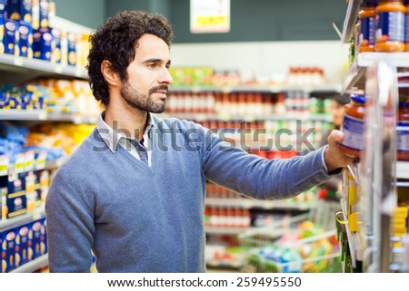 Attractive man shopping in a supermarket