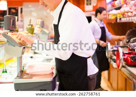 Shopkeeper working in his grocery store