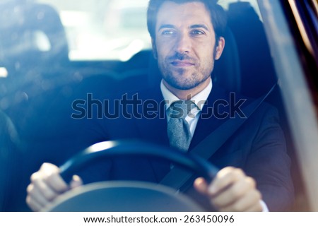Handsome man driving his car