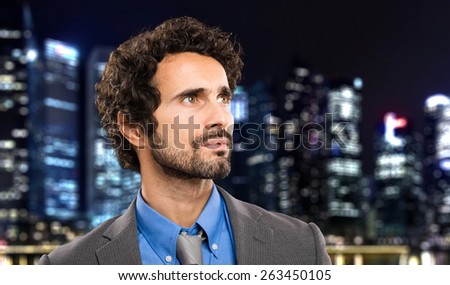 Mature businessman in the city at late night
