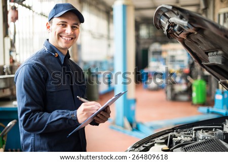 Portrait of a mechanic at work in his garage