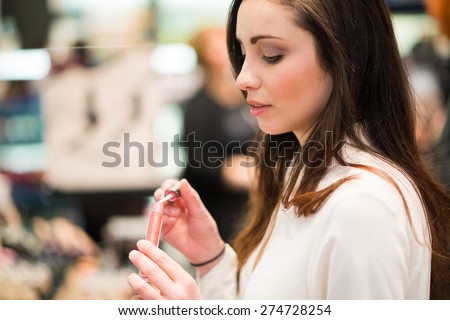 Portrait of a woman trying a product in a beauty shop