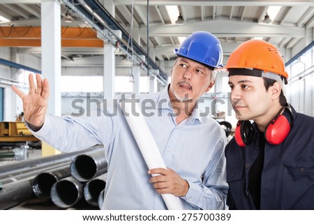 Foreman explaining a job to a worker