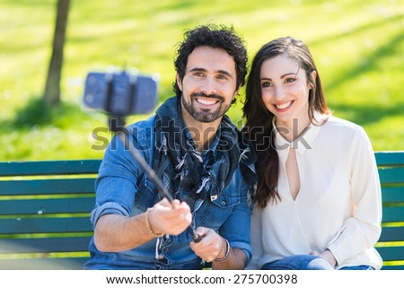 Couple using a selfie stick