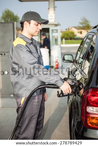 Portrait of a gas station attendant at work