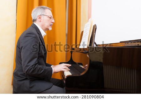 Man playing piano in a conservatory