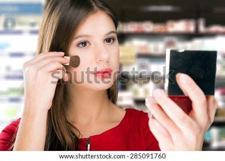 Woman trying a product in a beauty shop