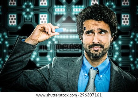 Man plugging a memory key in his brain
