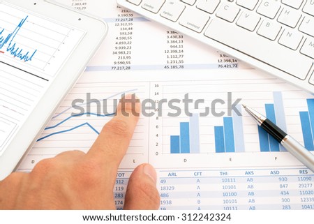 Keyboard, pen, tablet and financial documents