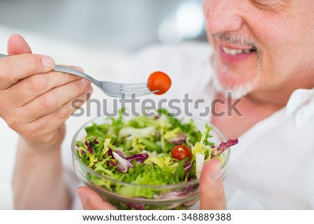 Senior man enjoying a healthy salad