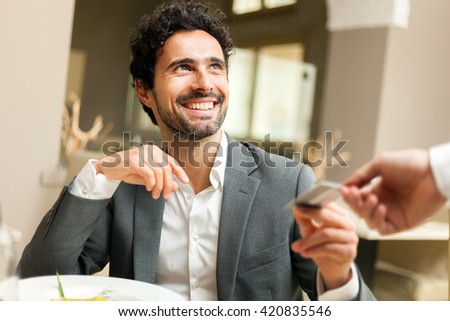 Man paying the bill with a credit card