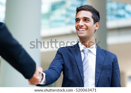 Businesspeople shaking hands outdoor