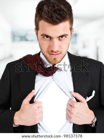 Businessman tearing his shirt like a superhero. You can add your own logo.