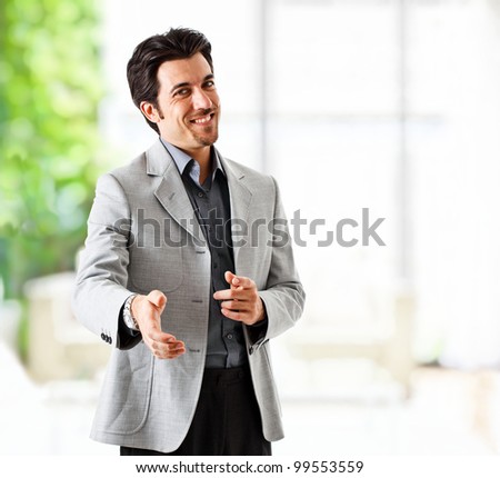 Portrait of an handsome businessman introducing himself
