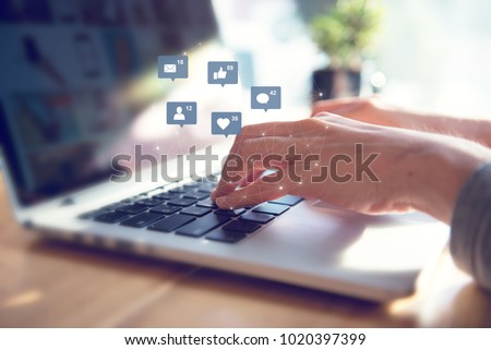 Businesswoman hands using laptop with icon social media and social network, Marketing concept.