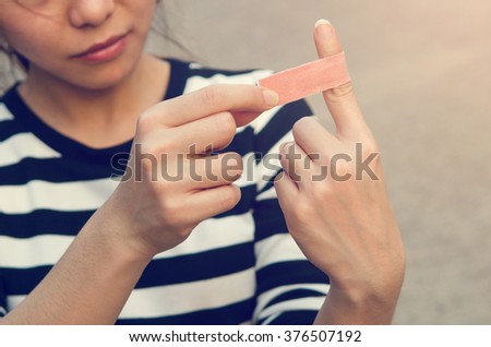 Close up bandage on an injured finger, outdoor.