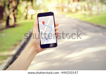 Tourist using navigation app on the mobile phone. Freedom and active lifestyle concept