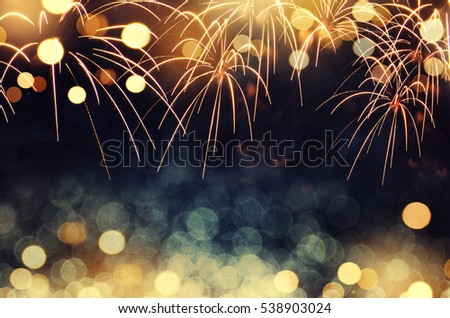Gold and dark blue Fireworks and bokeh in New Year eve and copy space. Abstract background holiday.