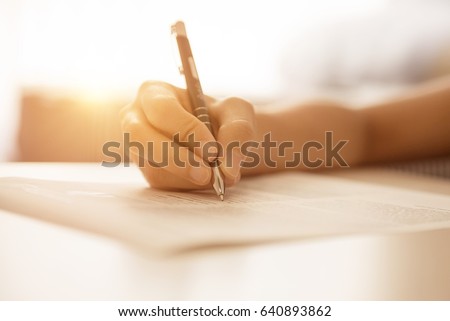 Woman hand writing on paper in office, fill in empty document template applying for job in morning, resume, background and copy space.