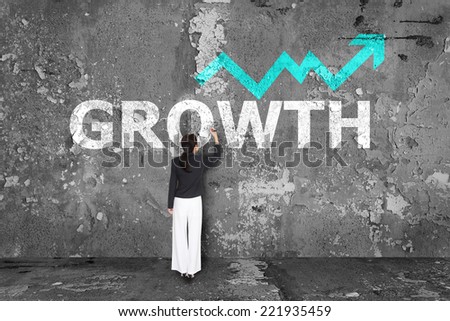 business woman drawing growth