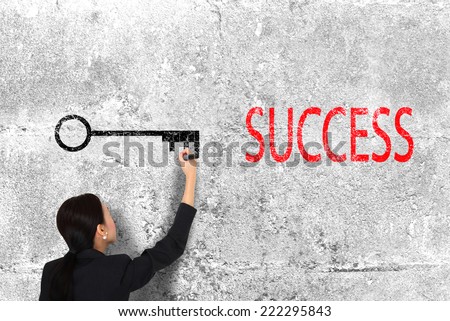 business woman drawing key success